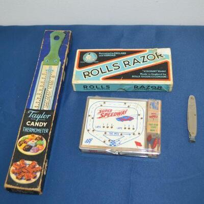 LOT 109  VINTAGE CANDY THERMOMETER, ROLLS RAZOR AND PEG GAME