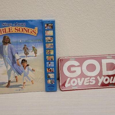 Lot 89: Religious Book NEW and GOD LOVES YOU License Plate Accent