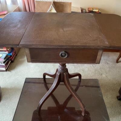 Lot 13L. Mahogany coffee table with glass top (28â€W x 17.5â€D x 18Hâ€) and occasional drop-leaf table (15â€ x 16â€ x 28â€} with...