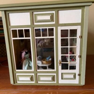 Lot 15L. Two circa 1960 doll houses, Victorian and millinery shop, with furniture--$120