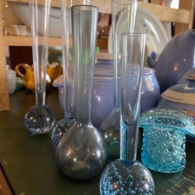 Lot 17L. Collection of blue glassware, 5 bud vases, Hall blue ceramics, blue plate, etc.--$95