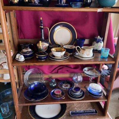 Lot 18L. Blue Limoges, blue ceramics, cobalt blue glass, urns, candlestick wax protectors, etc.--$75