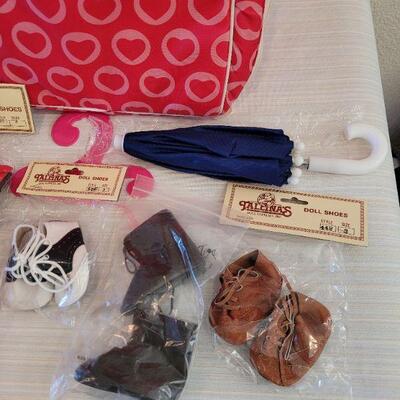 Lot 114: Journey Girl Doll with Carrying Case, an Outfit, Umbrella and lots of Shoes