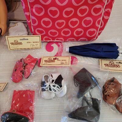 Lot 114: Journey Girl Doll with Carrying Case, an Outfit, Umbrella and lots of Shoes