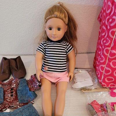 Lot 114: Journey Girl Doll with Carrying Case, an Outfit, Umbrella and lots of Shoes