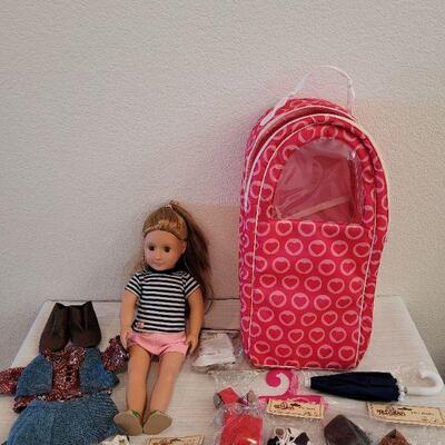 Lot 114: Journey Girl Doll with Carrying Case, an Outfit, Umbrella and lots of Shoes