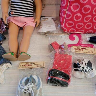 Lot 114: Journey Girl Doll with Carrying Case, an Outfit, Umbrella and lots of Shoes