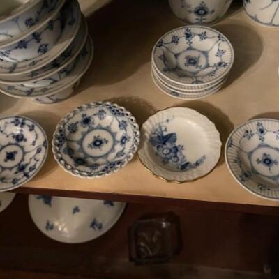 Lot 22DR. Large collection of Royal Copenhagen blue and white dishes (some as is) and several serving piecesâ€”coffee pot, tea pots,...