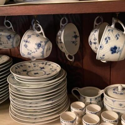 Lot 22DR. Large collection of Royal Copenhagen blue and white dishes (some as is) and several serving piecesâ€”coffee pot, tea pots,...