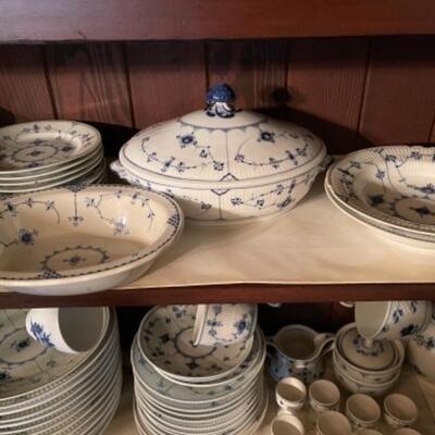 Lot 22DR. Large collection of Royal Copenhagen blue and white dishes (some as is) and several serving piecesâ€”coffee pot, tea pots,...