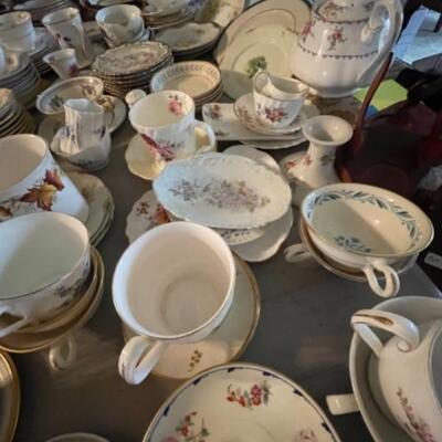 Lot 23DR. Huge lot of assorted cups and saucers along with teapot, creamers and sugars, dessert plates, extra saucers--$95