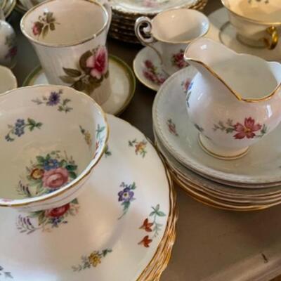 Lot 23DR. Huge lot of assorted cups and saucers along with teapot, creamers and sugars, dessert plates, extra saucers--$95