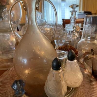 Lot 24DR. Collection of crystal and glass vases, decanters, flower frogs, salt/pepper shakers, ring dish, ice bucket, pitcher, etc.--$130