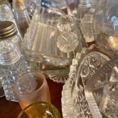Lot 24DR. Collection of crystal and glass vases, decanters, flower frogs, salt/pepper shakers, ring dish, ice bucket, pitcher, etc.--$130