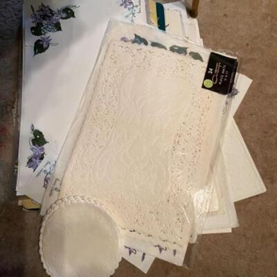 Lot 25DR. Assorted linens, tablecloths, damask napkins, paper doilies, placemats, etc.â€”$110