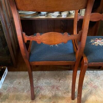 Lot 42DR. Pair of carved chairs with needlepoint cushions--$125