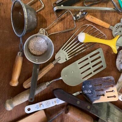 Lot 74K. Vintage cooking utensilsâ€”ladles, graters, shears, butter slicer, cheese slicer, etc.--$65