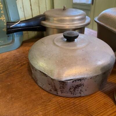 Lot 75K. Assortment of pots, pans, trays, pressure cooker, Dutch oven (Wagner Ware)--$85