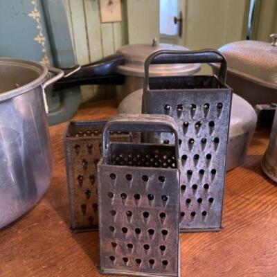 Lot 75K. Assortment of pots, pans, trays, pressure cooker, Dutch oven (Wagner Ware)--$85