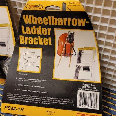 Lot 235: (2) New Garage Shop WHEELBARROW OR LADDER Hanging Bracket 