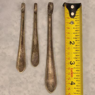 3 vintage spoon pendants.