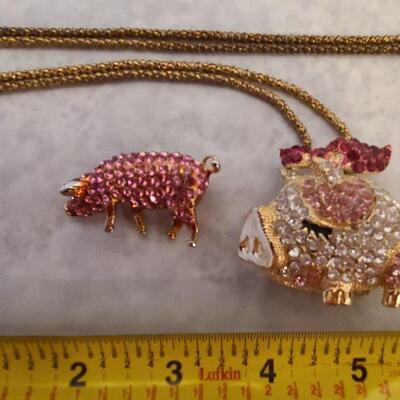 Fun rhinestone pig pendant necklace and brooch. 