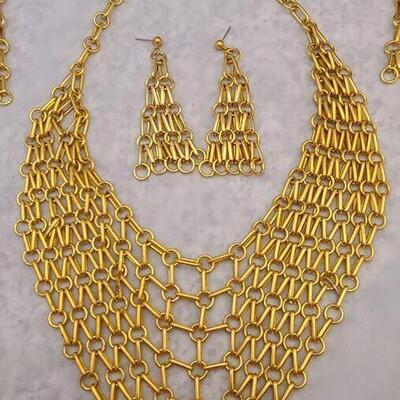 Gold tone chain link necklace with 2 pair of matching pierced earrings. 
