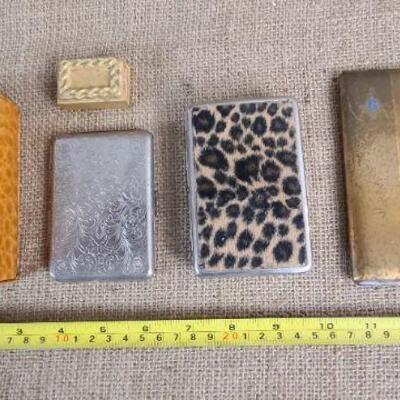 4 vintage cigarette cases and one matchbox