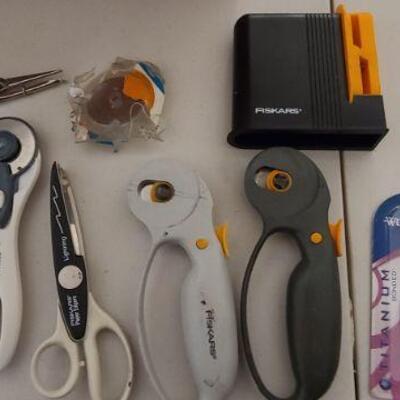 Assortment of cutting tools, scissors, blades, and more