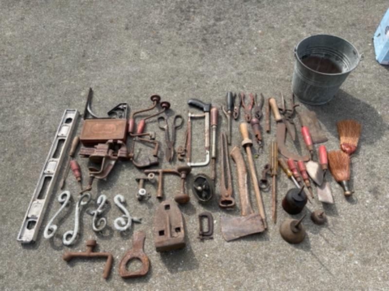Lot 87K. Vintage tools—leveler, hand drills, door knobs, pail, brackets, screw drivers, anvils