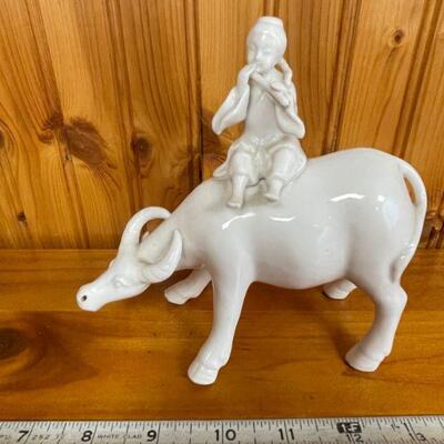 Porcelain Water Buffalo with flute player on back