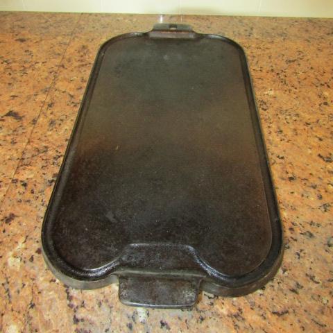 LOT 105 WAGNER WARE CAST IRON GRIDDLE | EstateSales.org