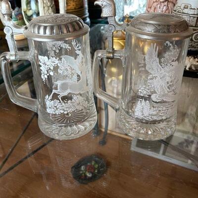 2 glass steins with pewter lids 