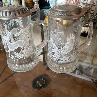 2 glass steins with pewter lids 