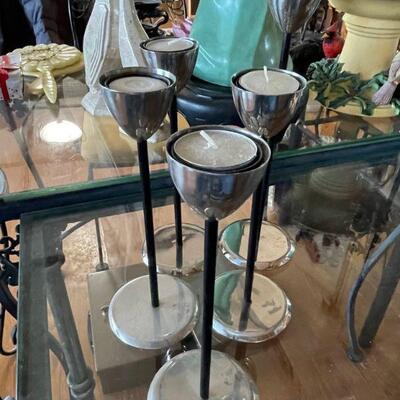Set of 4 candle holders .