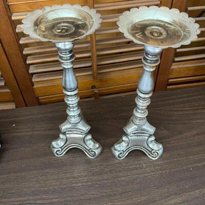 Pair of large metal candle stands 