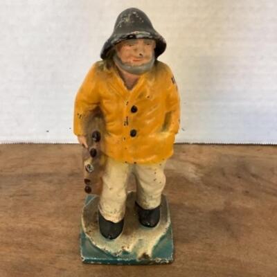303 Small Cast Iron Sea Man Figurine and Ceramic Lighthouse 