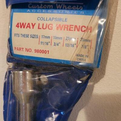 Lot 89: (2) New Tools - 4 Way Lug Wrench and Universal Socket