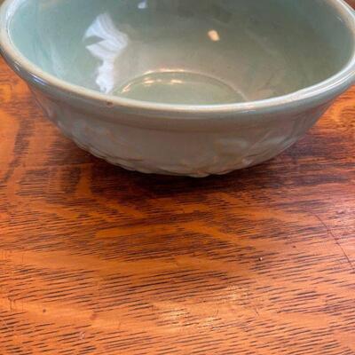 Vintage pottery bowl / stylized on sides 