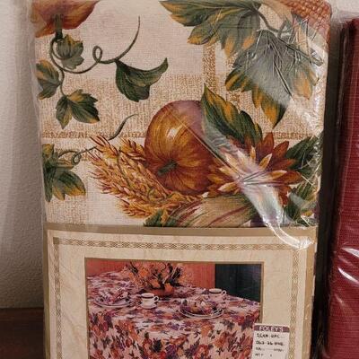 Lot 131: (2) New in Package Tablecloths - Fall and Dark Red