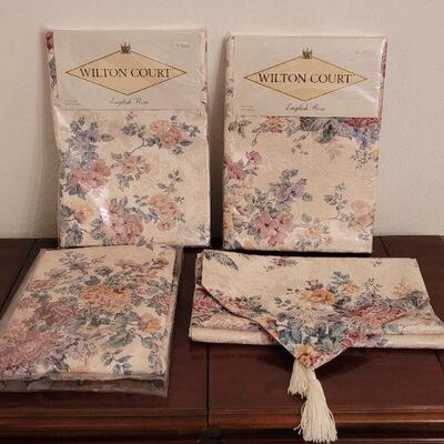 Lot 135: (3) New in Package Tablecloths and a Table Runner 