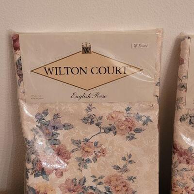 Lot 135: (3) New in Package Tablecloths and a Table Runner 