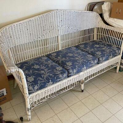 White wicker couch / blue cushions 