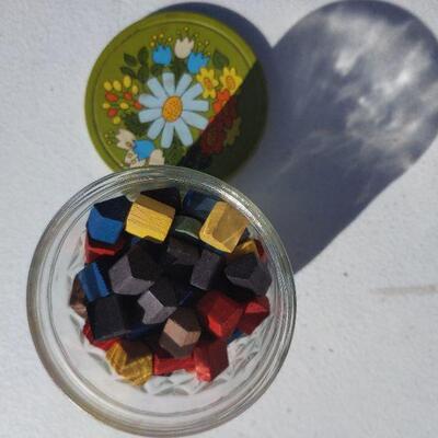 Vintage jar with wooden game pieces