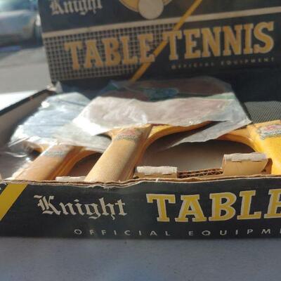 Ping pong paddles in box
