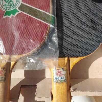 Ping pong paddles in box