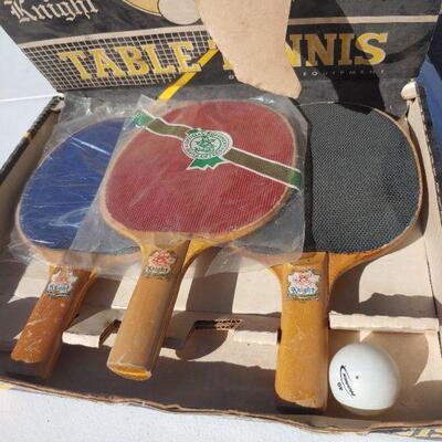 Ping pong paddles in box