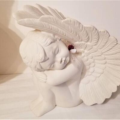 Lot #100  Plaster Bust of a Young Girl and Sleeping Cherub