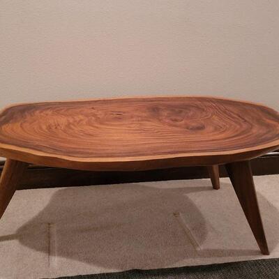 Lot 292: Mid Century Modern Planed Coffee Table (has a small ding in the varnish) 44.5" Ã— 22.5" Ã— 17" 