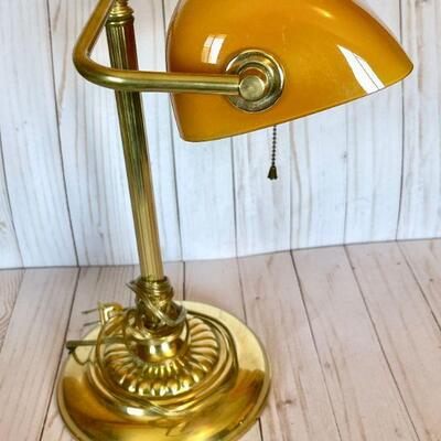 LOT 66   REPRODUCTION BRASS DESK LAMP AMBER GLASS SHADE